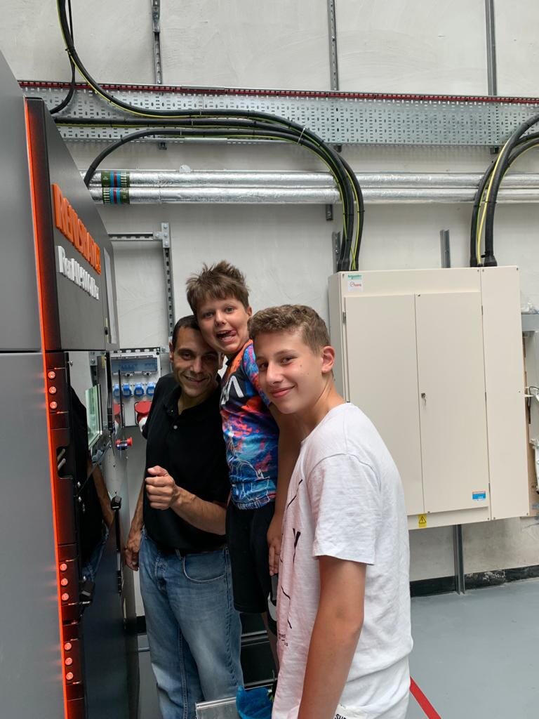 Youssef and his children on the Apex shop floor